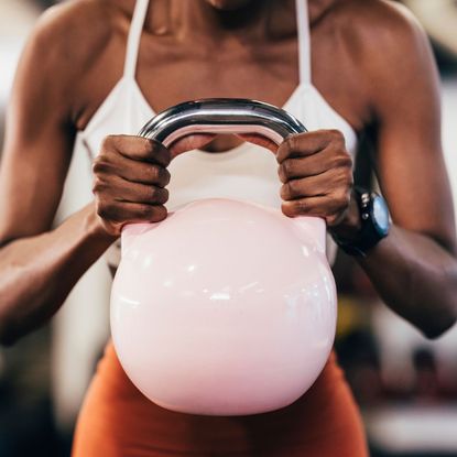 A young lady doing a beginners strength training workout for women