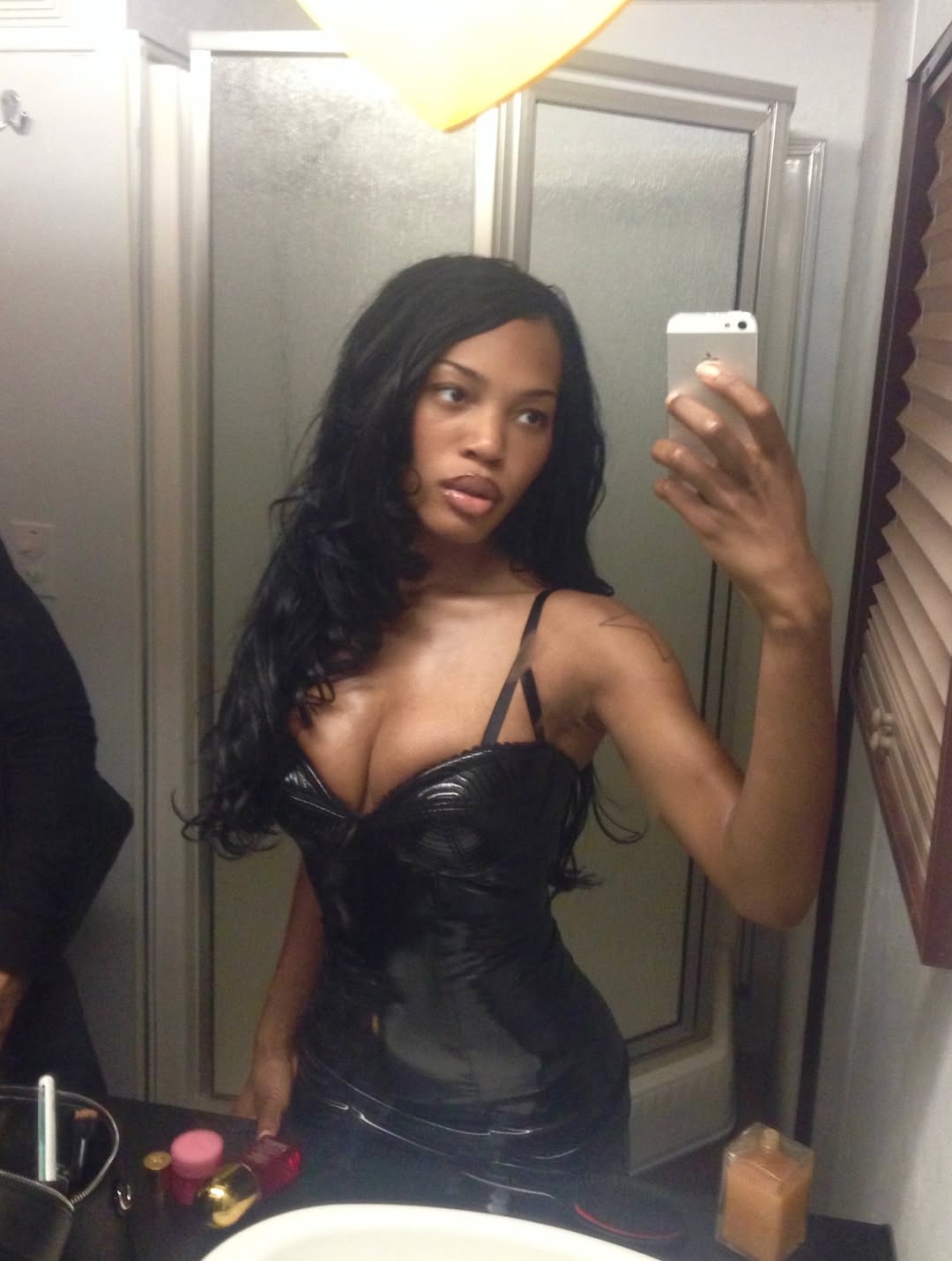 An image of Quenlin Blackwell in the bathroom mirror.