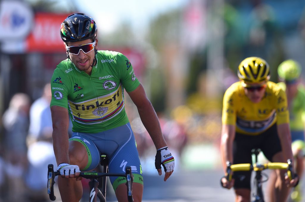 Peter Sagan celebrates his stage win as Chris Froome (Team Sky) enjoys a six second time bonus to extend his overall race lead