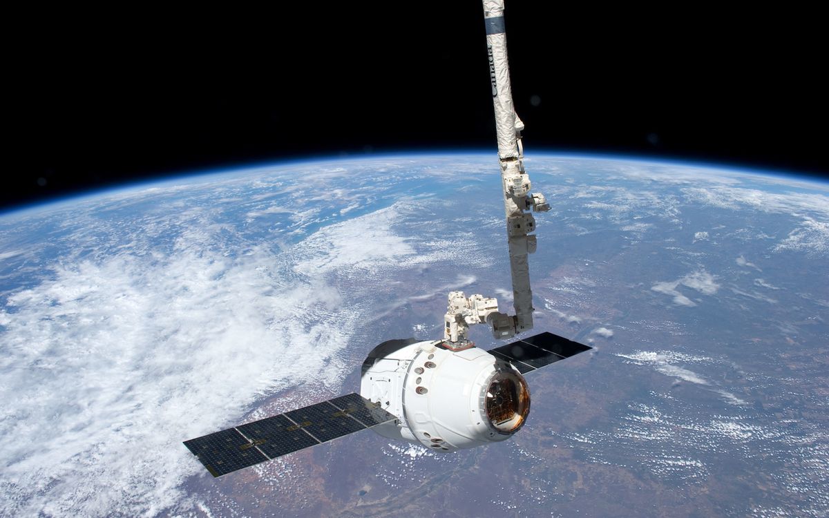 Robotic Arm Grapples SpaceX Dragon at International Space Station Space ...