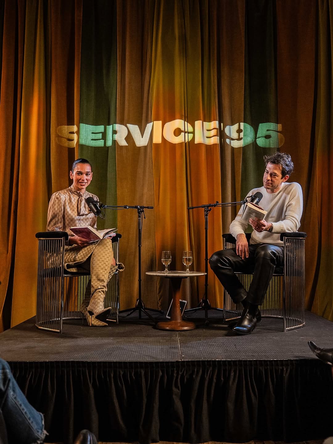 Dua Lipa hosted a Service95 book club event in a monogrammed Gucci Spring 2026 skirt set