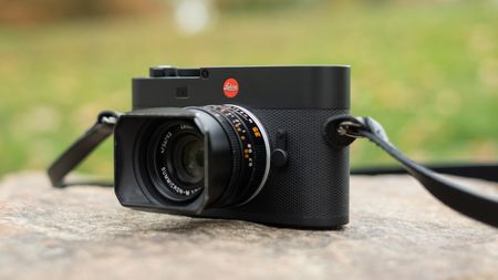 Leica M EV1 digital camera with lens attached on a stone surface