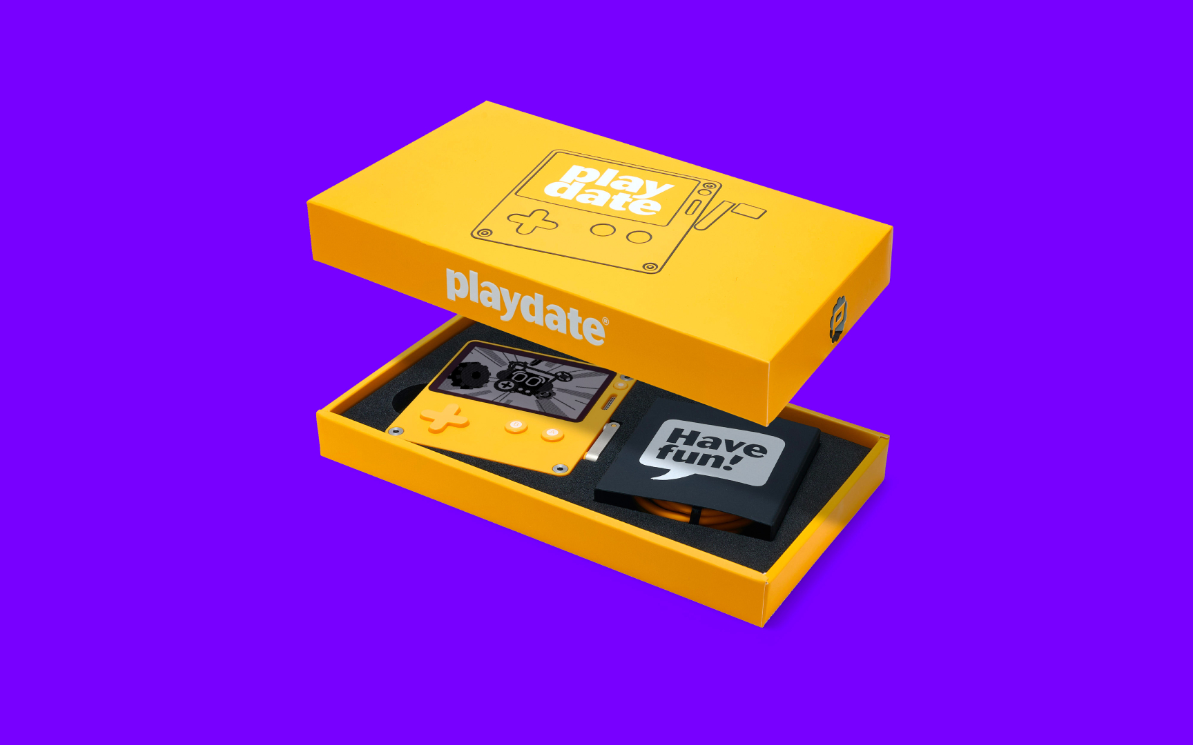 The Playdate console in its box