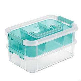 A clear storage container with a blue shelf
