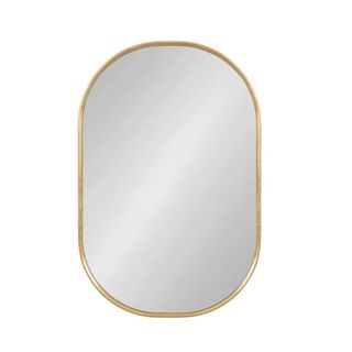 A curved oval mirror with gold piping around the edges and a silver middle