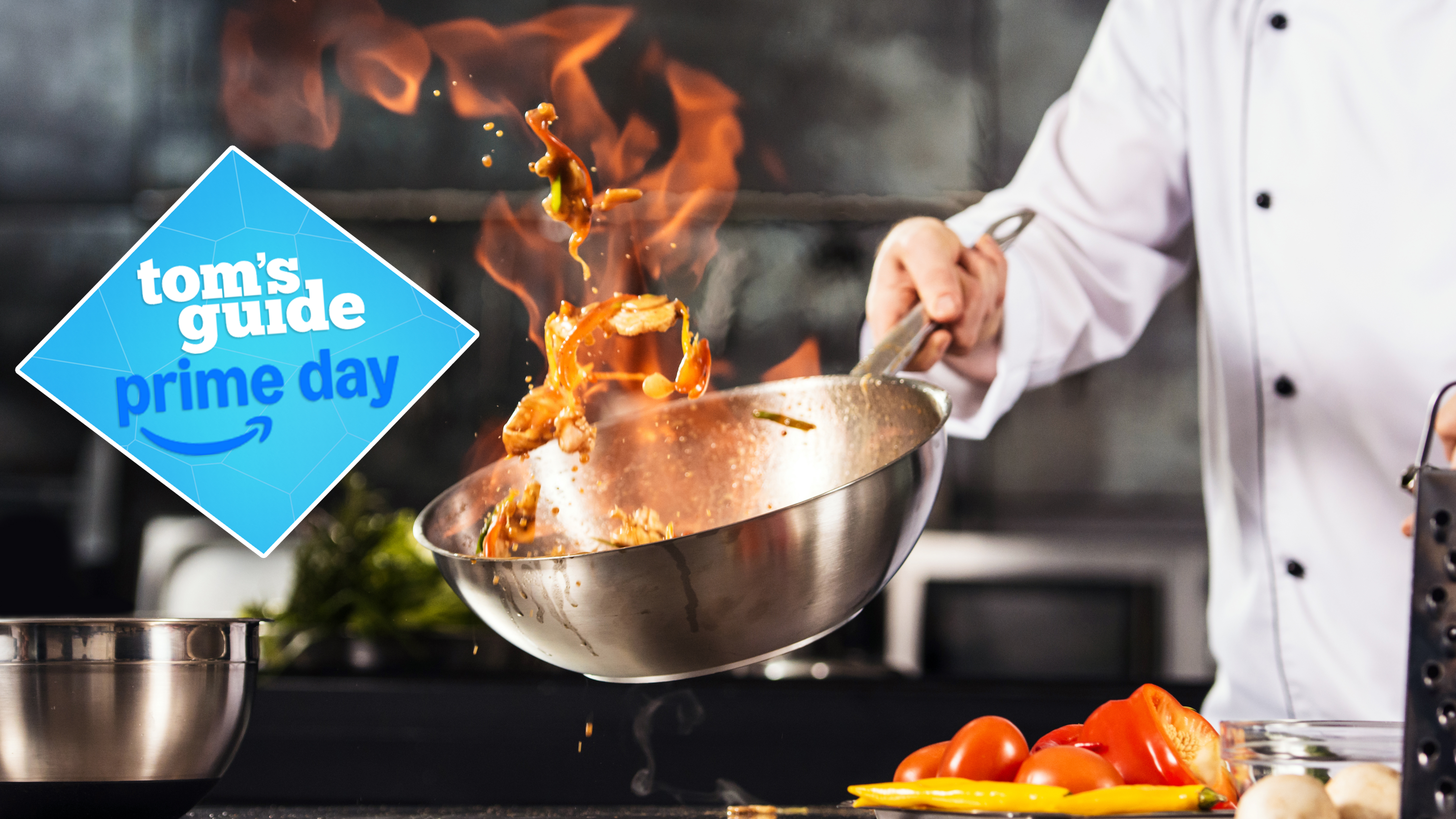 A chef flambéing in a pan with fire coming out the top. A Tom&#039;s Guide Prime Day deal badge is in the left of the image.