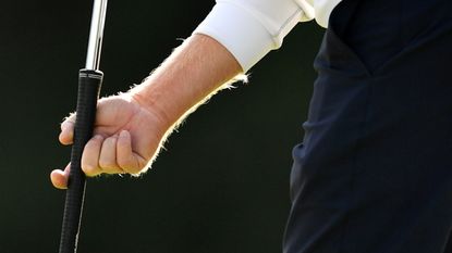 Close-up of a player holding a putter