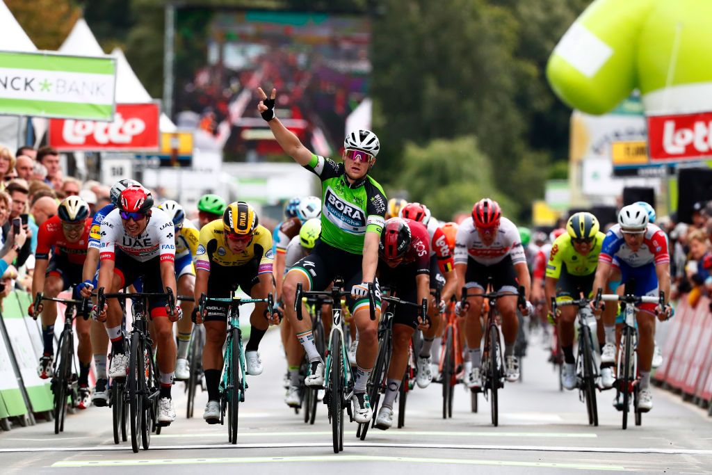 Sam Bennett (Bora-Hansgrohe) hits the line first