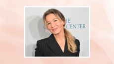 Image of Renée Zellweger smiling with curled blonde ponytail, wearing a black pinstripe blazer, on a pink watercolour background