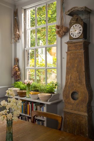 grandfather clock in living room in period home