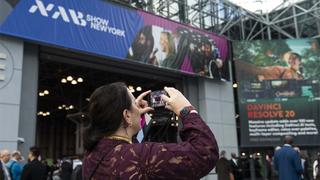 Attendee taking photo of NAB Show New York entrance