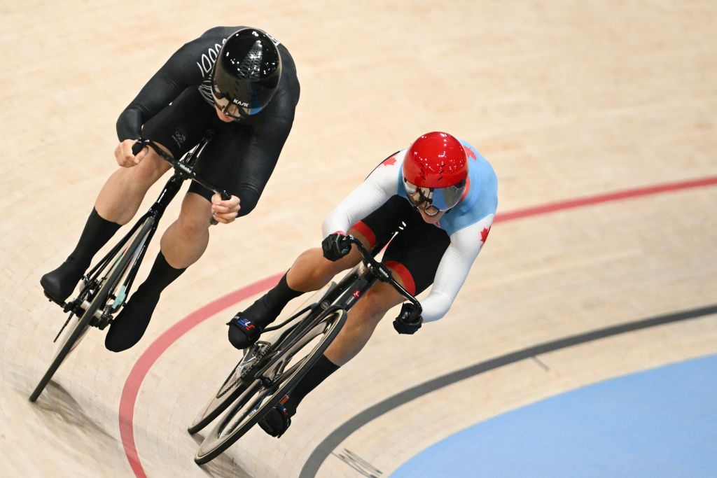 Canada's Kelsey Mitchell and New Zealand's Ellesse Andrews compete in a women's track cycling sprint 1/8 final of the Paris 2024 Olympic Games at the Saint-Quentin-en-Yvelines National Velodrome in Montigny-le-Bretonneux, south-west of Paris, on August 10, 2024. (Photo by SEBASTIEN BOZON / AFP)
