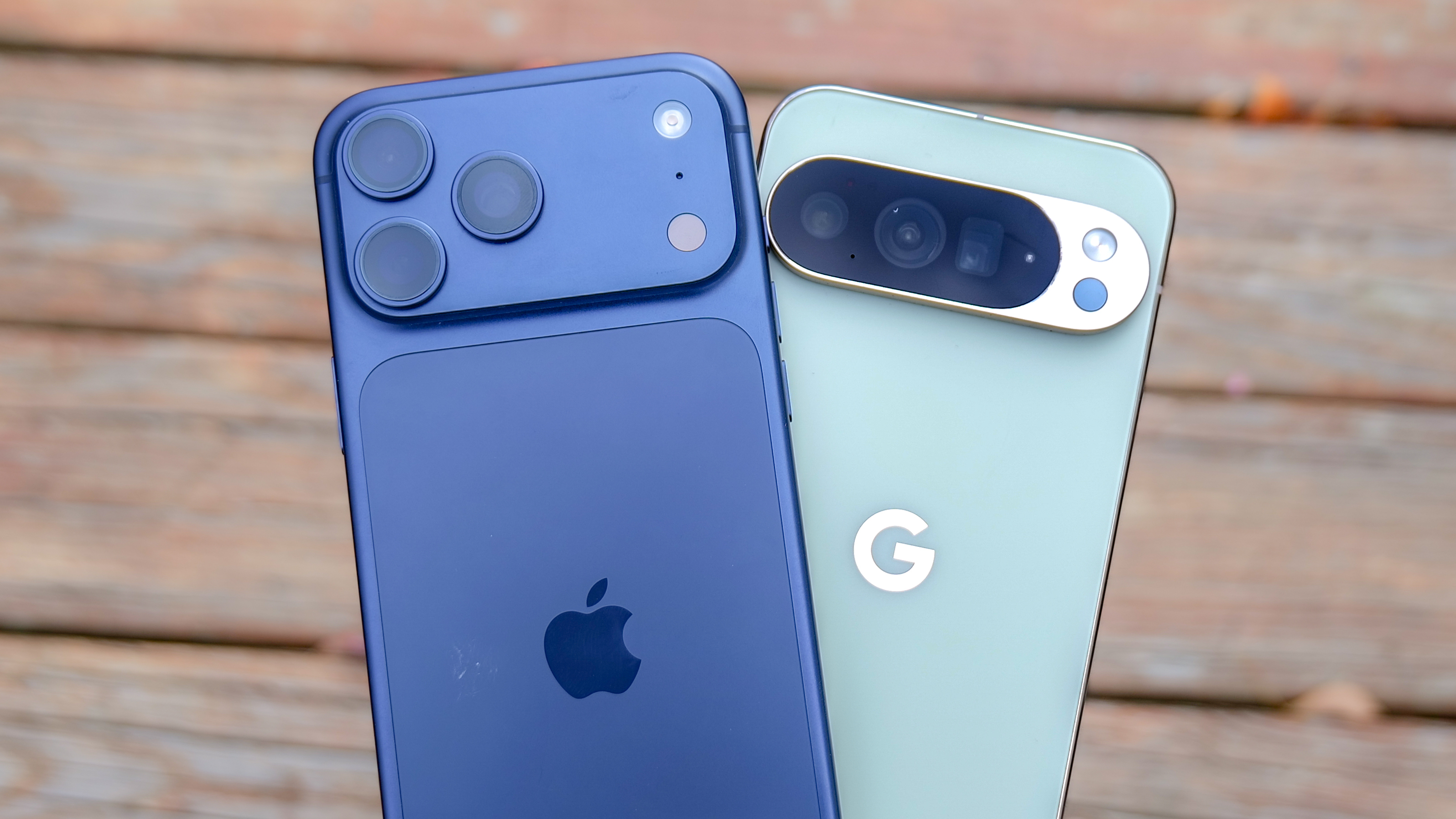 iPhone 17 Pro Max vs Pixel 10 Pro XL held in the hand.