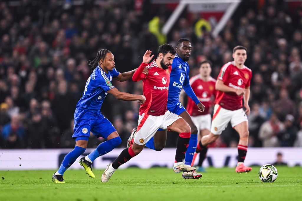 MANCHESTER, ENGLAND - OCTOBER 30: Bruno Fernandes of Manchester United (C) dribbles Boubakary Soumaré of Leicester City (R) during the Carabao Cup Fourth Round match between Manchester United and Leicester City at Old Trafford on October 30, 2024 in Manchester, England. (Photo by Will Palmer/Eurasia Sport Images/Getty Images)