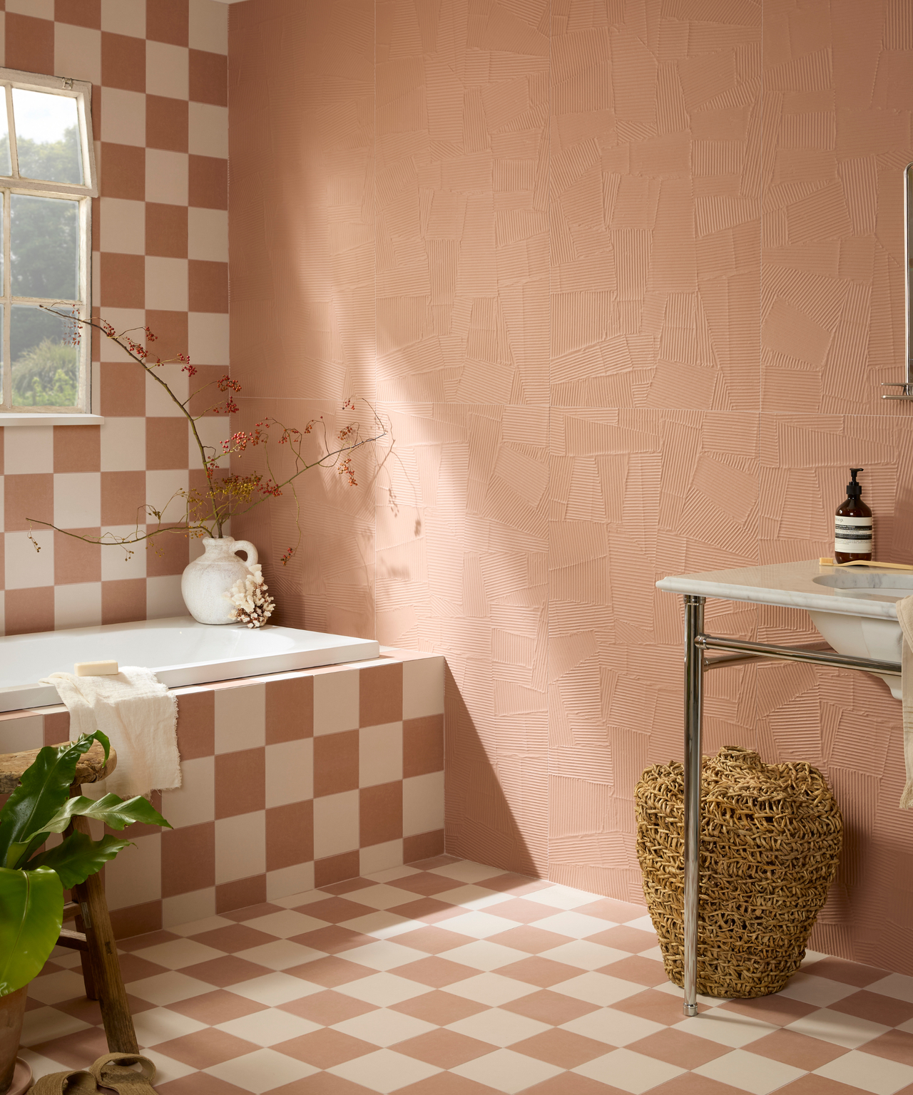 Bathroom with chequerboard pattern on wall, bath and floor