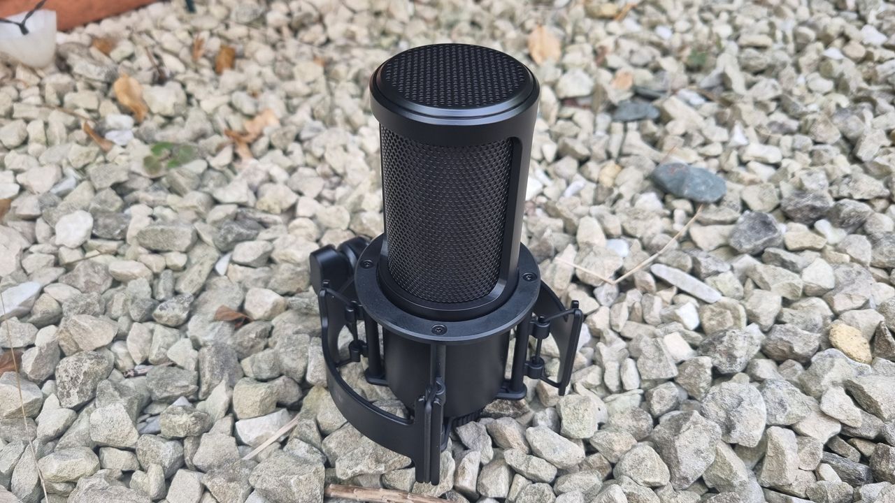 The Shure SM4 Studio Kit, shown on a white gravel background