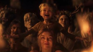 Divinity trailer still - mother and daughter watching a dude burn to death