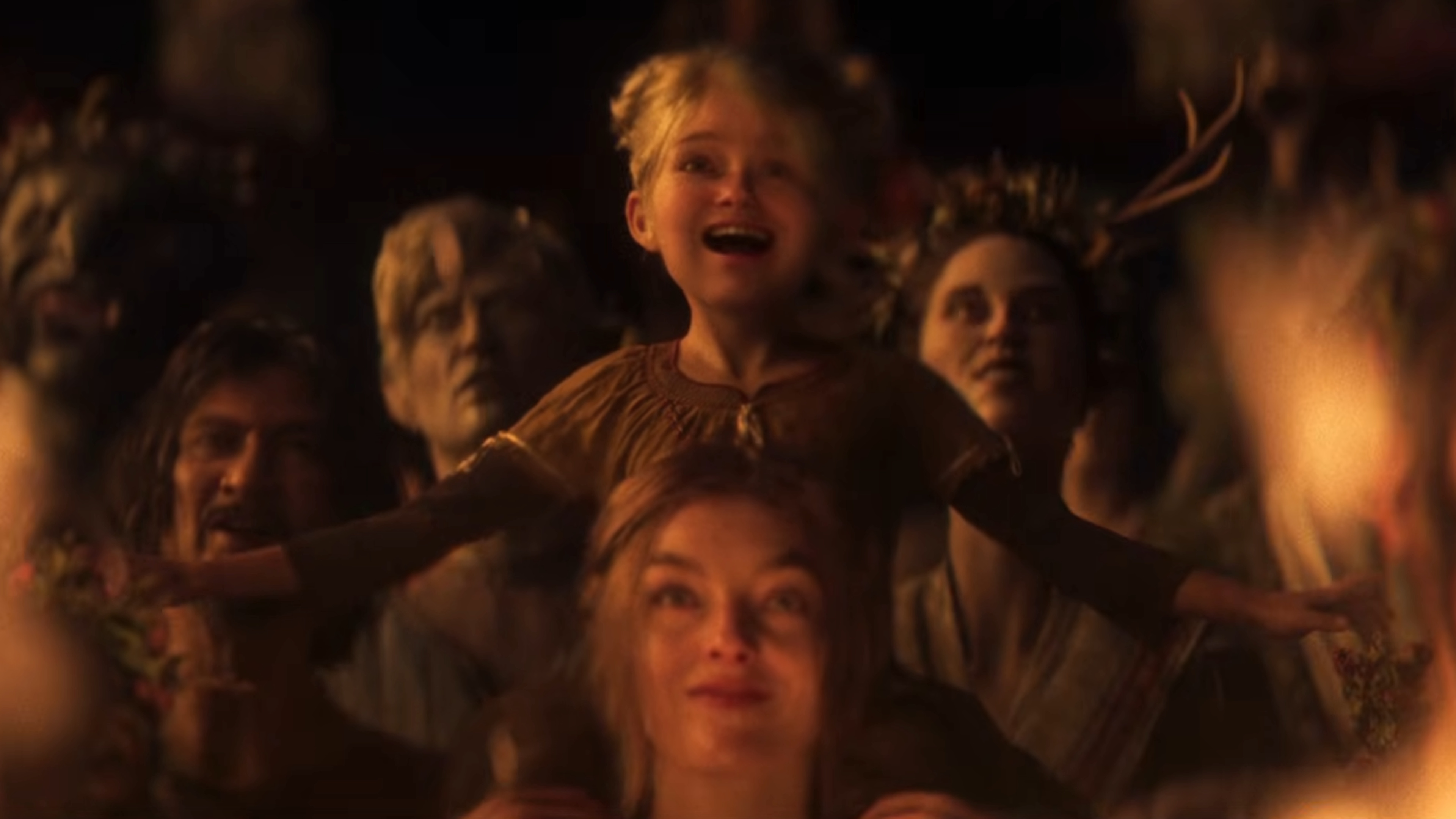 Divinity trailer still - mother and daughter watching a dude burn to death