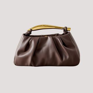 flat lay image of a brown handbag