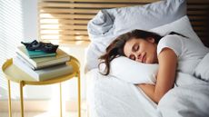 Recurring dreams: A woman lies in bed asleep