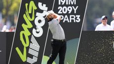 Jon Rahm holds his finish on a tee shot at a LIV Golf tournament