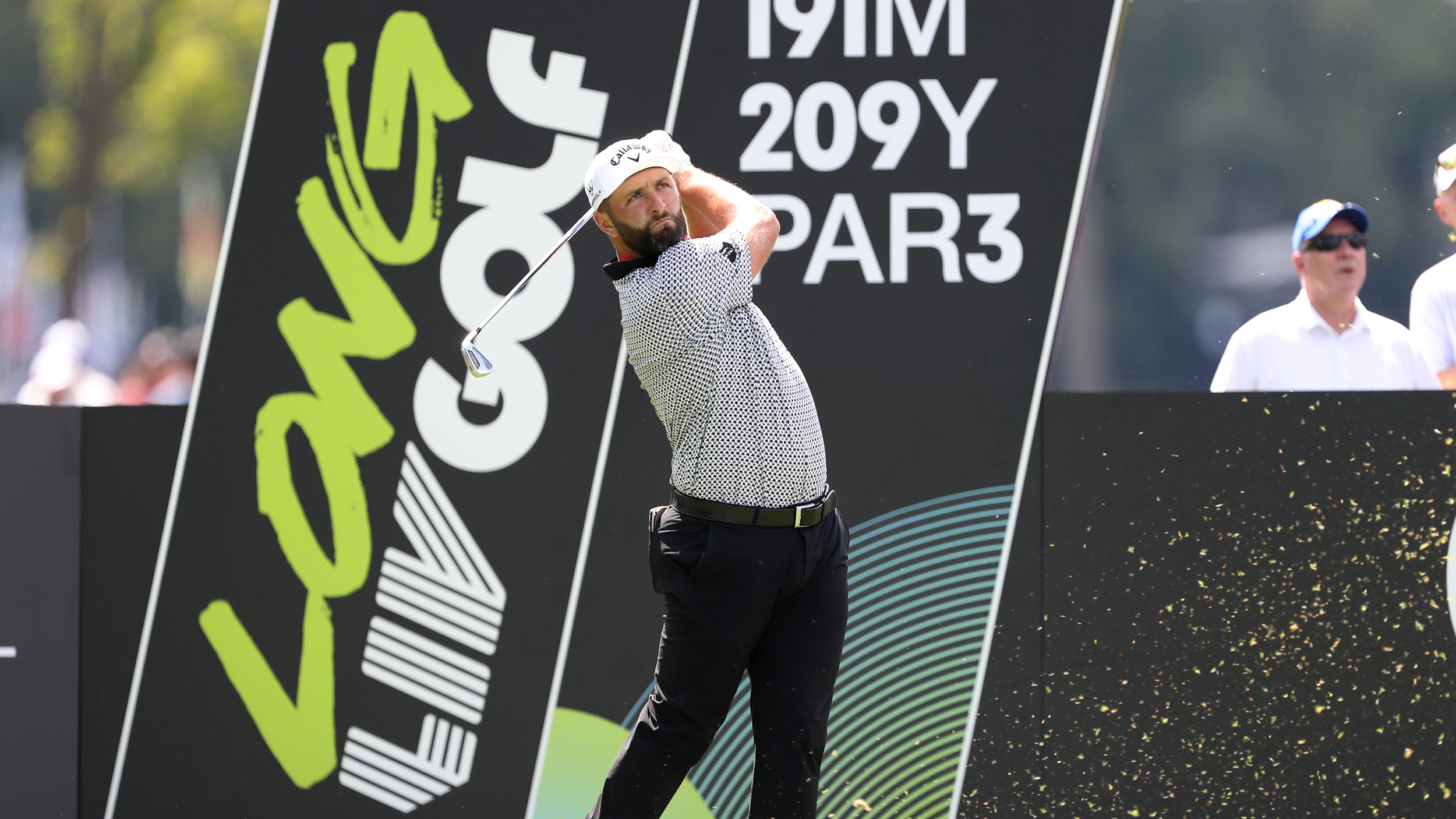 Jon Rahm holds his finish on a tee shot at a LIV Golf tournament