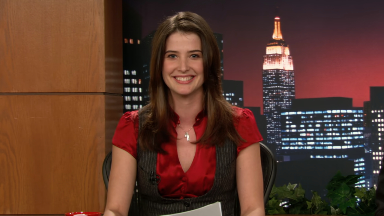 Cobie Smulders as Robin Scherbatsky delivering the news on How I Met Your Mother