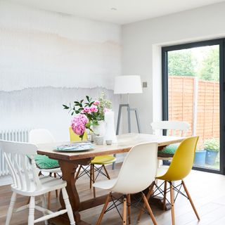 Dining room with ombre wall and wooden table