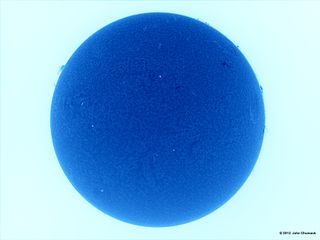 Sun in Blue Peppered With Sunspots