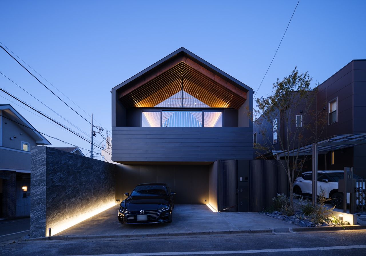 Le49Ⅱ by APOLLO hero exterior at dusk with pitched roof is part of our japanese architects&#039; japanese house roundup