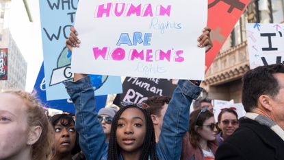  An activist participates in the Women's March Los Angeles 2018 on January 20, 2018 in Los Angeles, California