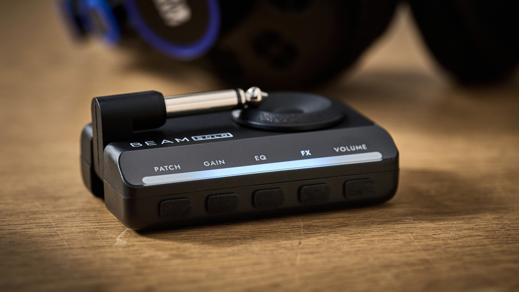 The Blackstar Beam Solo headphone amp for guitar on a wooden table