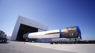 The first stage of Blue Origin's New Glenn rocket, which launched NASA’s ESCAPADE Mars mission on Nov. 13, 2025, is rolled into a hangar at Cape Canaveral Space Force Station for inspection and refurbishment. Blue Origin CEO Dave Limp posted this photo on X on Nov. 20, 2025.