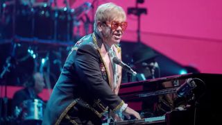 Elton John playing the piano in the Elton John Live: Farewell From Dodger Stadium trailer