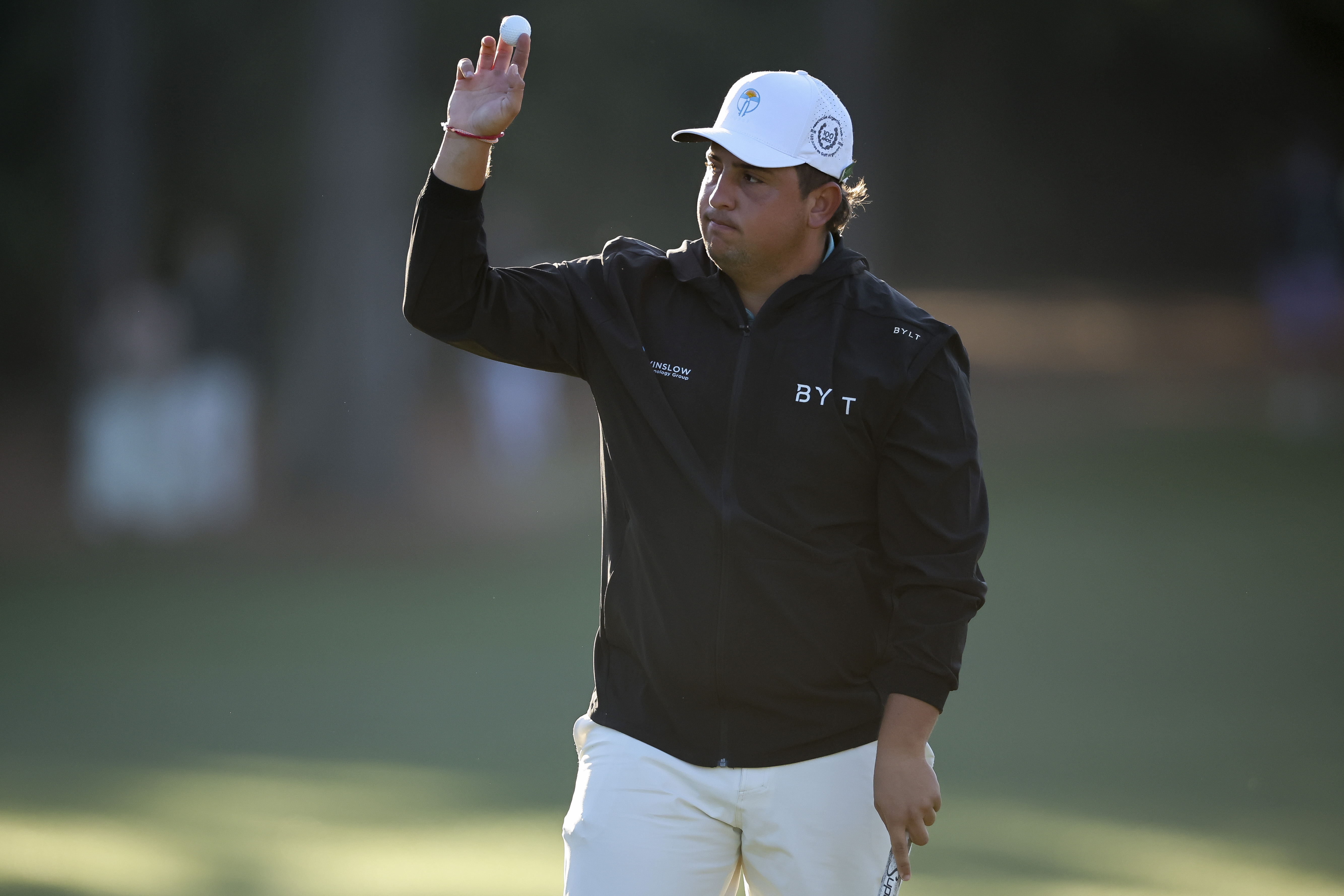 Amateur Mateo Pulcini waves on the first green during the second round of the 2026 Masters Tournament at Augusta National Golf Club