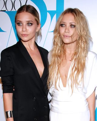 The Olsen twins with differing hairstyles.