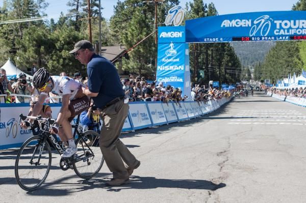 Sylvain Georges (AG2R La Mondiale) is kept upright after his victory by a race official