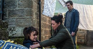 Cain Dingle finds Emma Barton in Holly’s room and orders her out but she just ignores him. He’s certain she’s up to no good and drags her outside. Shocked Moira Dingle reveals she had asked Emma to pack up Holly’s clothes and Cain realises he’s been played and is forced to walk away in Emmerdale.