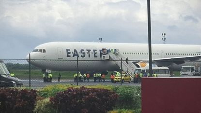 A plane carrying the deportees from the United States arrives at the Roberts International Airport outside of Monrovia, Liberia.