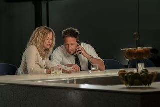 meg ryan and david duchovny sitting at an empty counter in what happens later