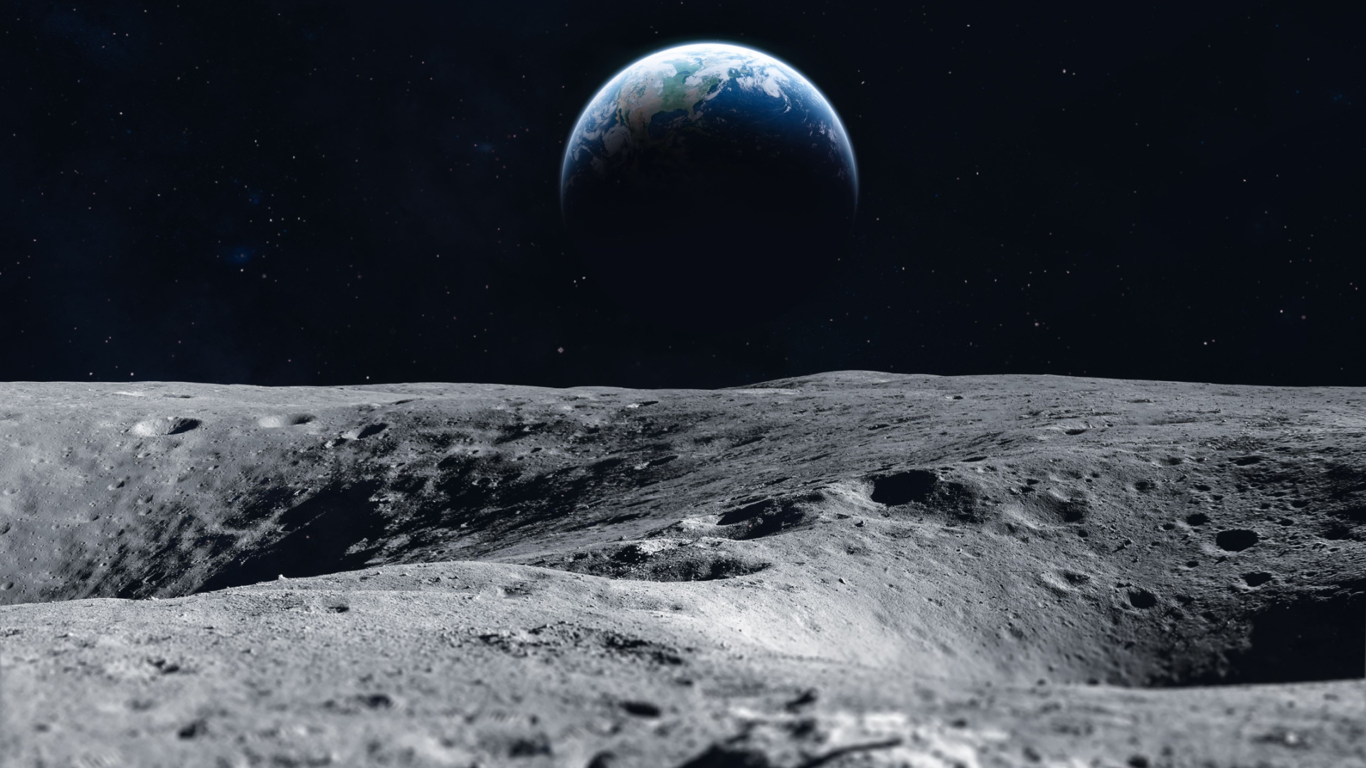 Поверхность Луны и Земля на горизонте