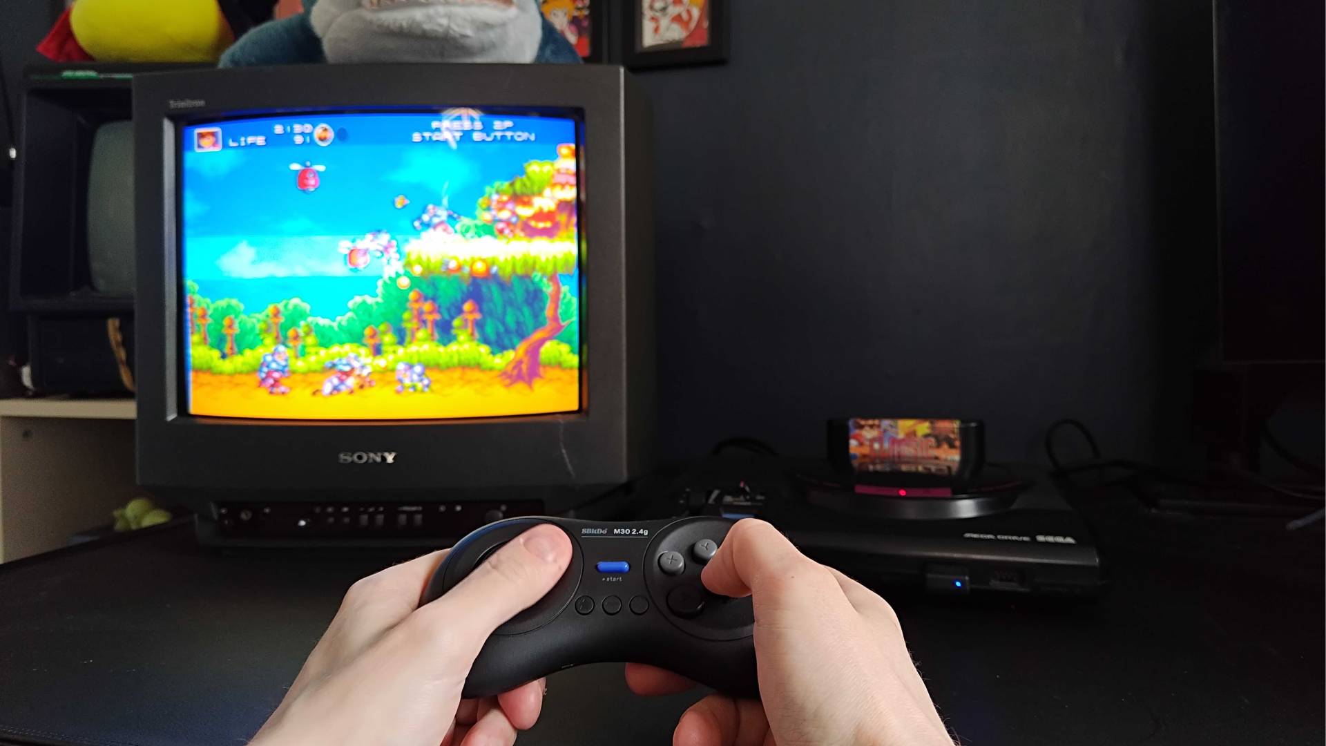 Phil Hayton using 8Bitdo M30 to play Gunstar Heroes on a Sony CRT TV using Japanese Sega Mega Drive.