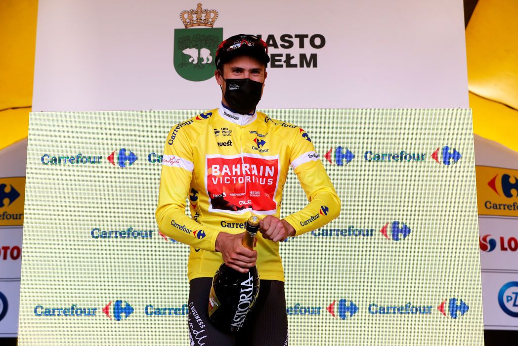 CHELM POLAND AUGUST 09 Phil Bauhaus of Germany and Team Bahrain Victorious Yellow Leader Jersey celebrates at podium during the 78th Tour de Pologne 2021 Stage 1 a 216km stage from Lublin to Chem 212m TourdePologne TDP2021 UCIWT on August 09 2021 in Chelm Poland Photo by Bas CzerwinskiGetty Images