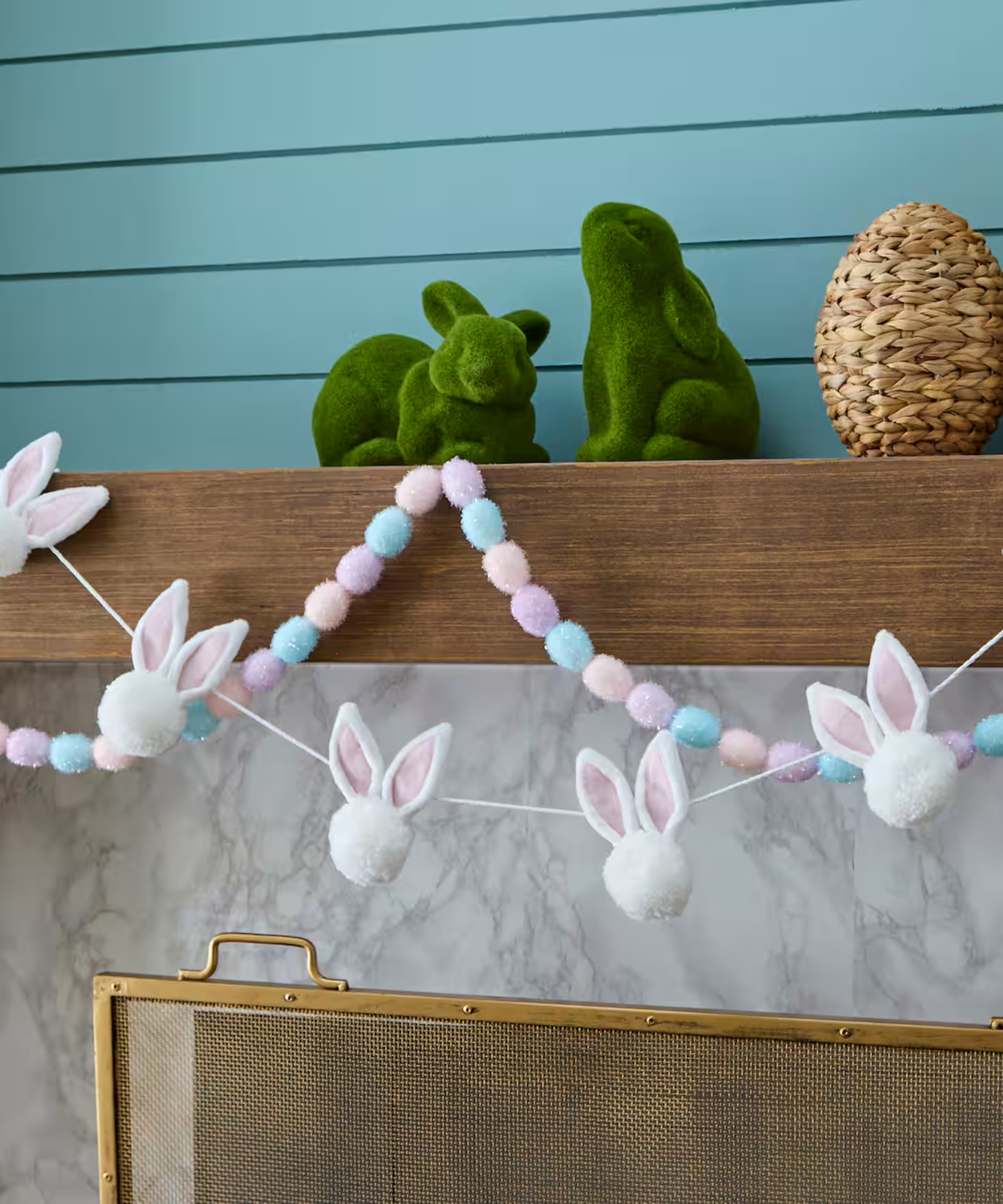 a mantel decorated for easter