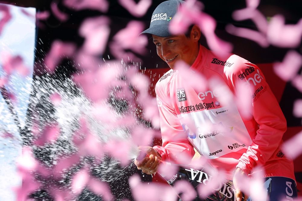 Esteban Chaves celebrates in pink on the stage 19 podium