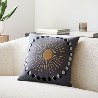 Moon Phases Pillow Cover Set on a sofa seat.