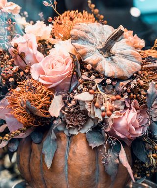 Pumpkin with fall flowers