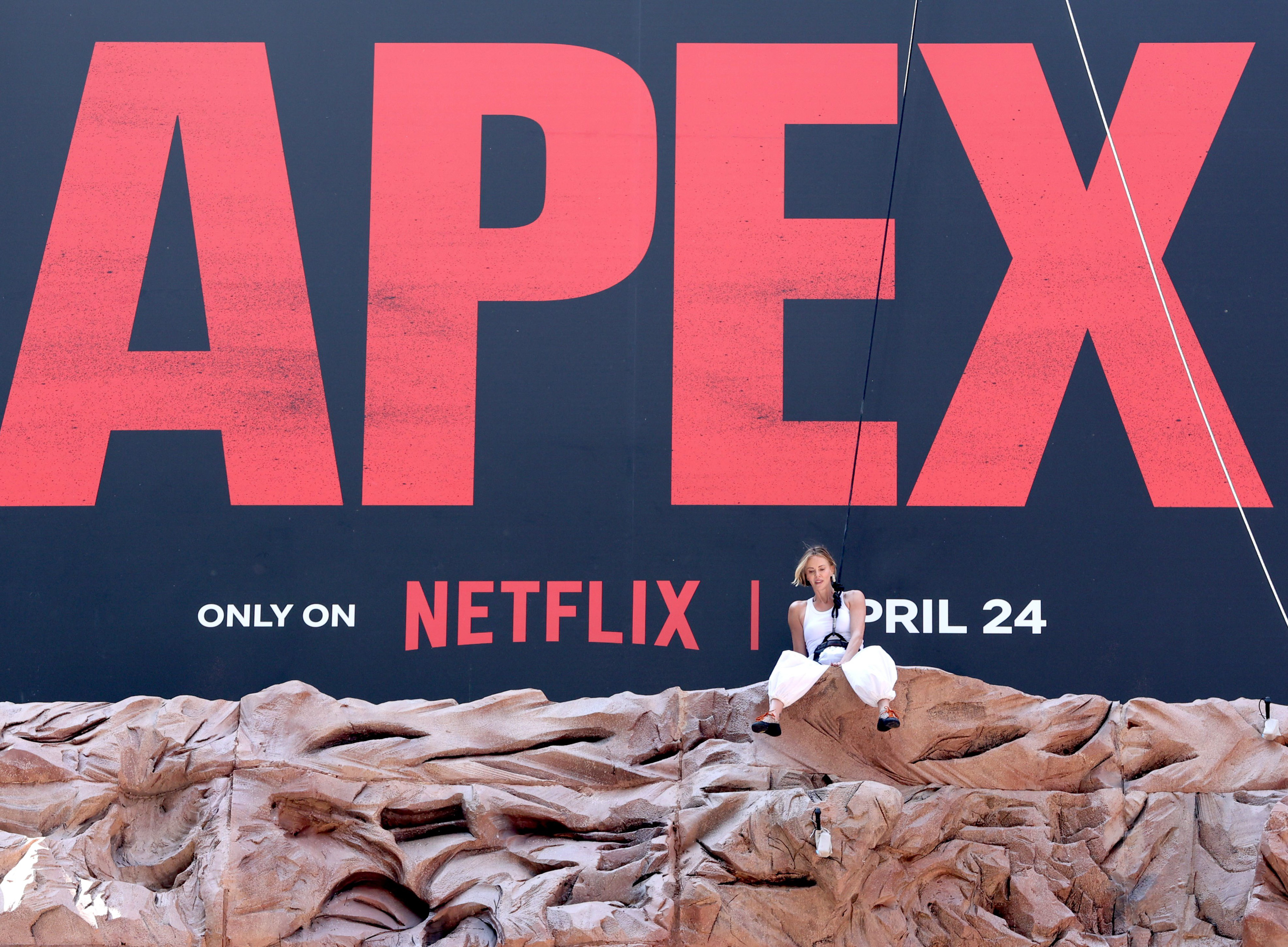 charlize theron on the apex press tour wearing black and white outfits