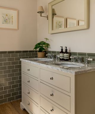 Neutral washstand in bathroom in coastal cottage in Northumberland