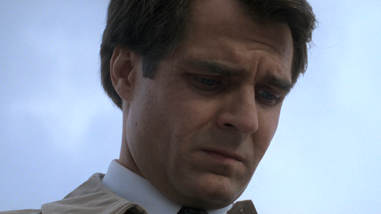 Henry Czerny looking down in Mission: Impossible
